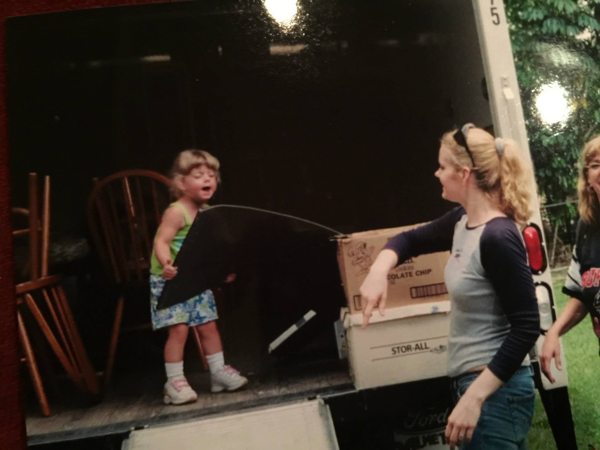An earlier family photograph of Abbey helping with hands-on work