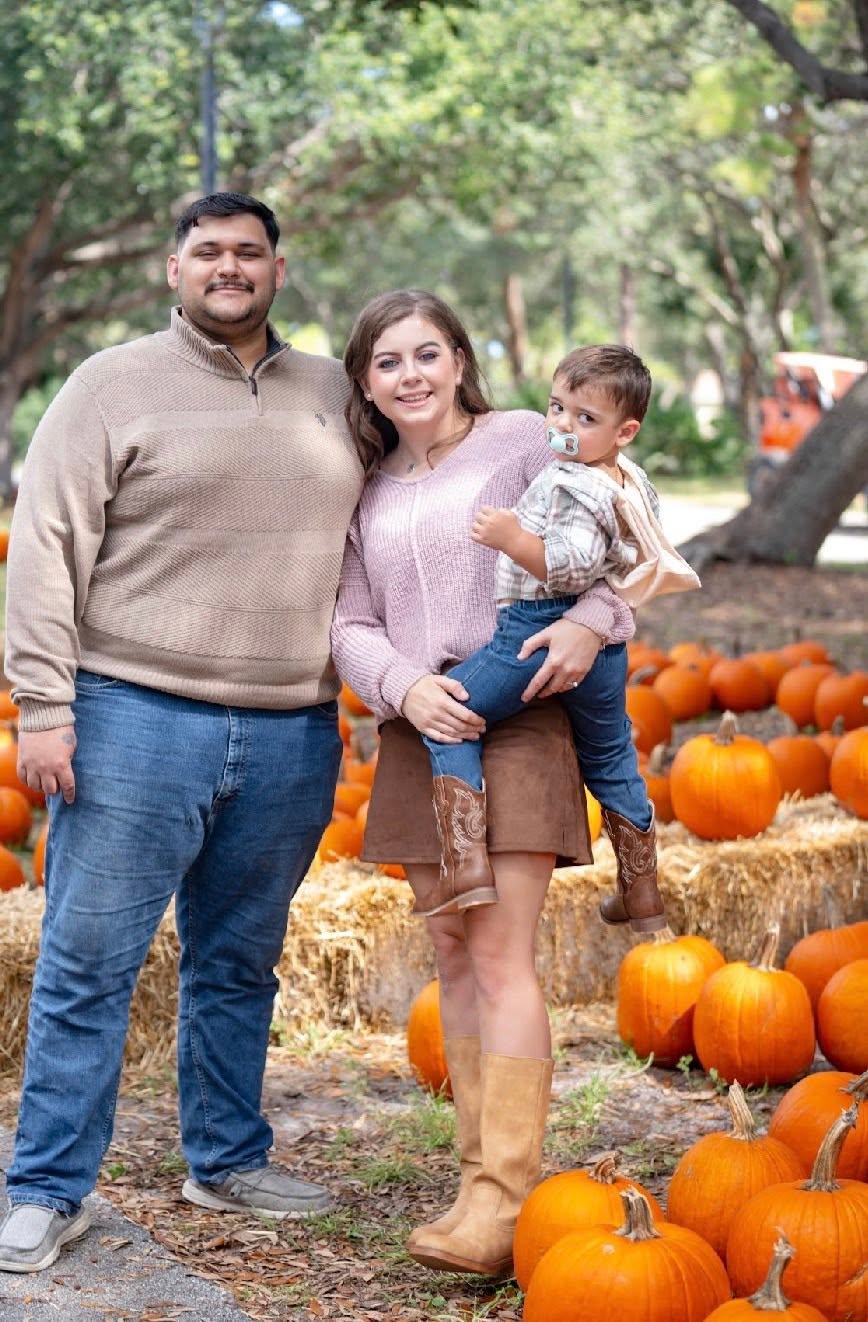 A family moment at a pumpkin patch